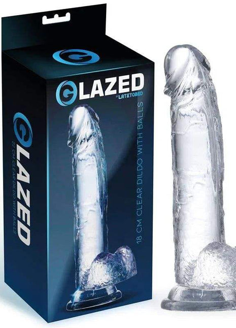 Realistic Dildo with Testicles in clear silicone, featuring a sculpted veined shaft, dual testicle base and suction-cup end.