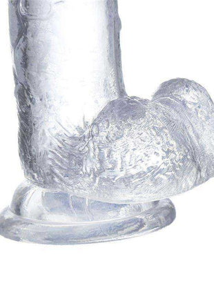 Realistic Dildo with Testicles in clear, translucent material, featuring a textured shaft and rounded dual-testicle base.