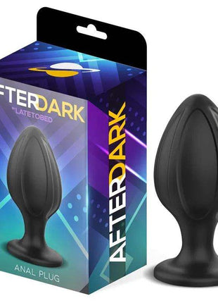 Rifter Butt Plug in black silicone with a smooth tapered body, rounded tip and wide flared base beside its Afterdark box