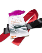 Sensual Massage guidebook with a white cover, accompanied by red and black satin ribbons and a purple feather