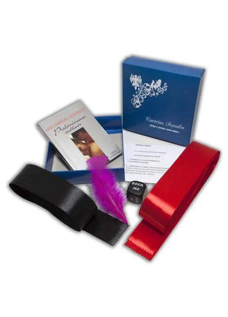 Sexual Caress Game with blue instruction box, red and black satin blindfolds, and a bright pink feather