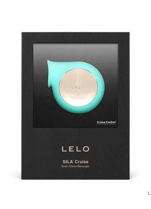 Sila Cruise Clitoris Sucker Aqua in aqua silicone with a rounded gold-toned control and curved mouth, displayed on its box
