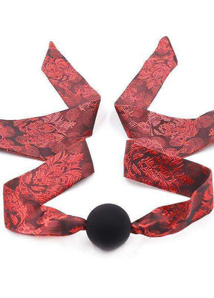 Red and black silicone ball gag with adjustable strap