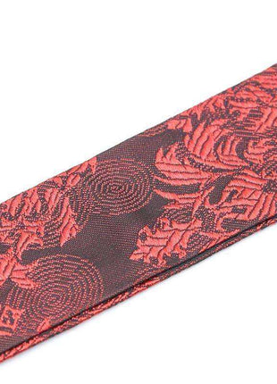 Silicone Ball Gag Red/Black with a red and black woven strap featuring an ornate floral pattern
