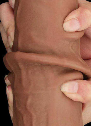 Sliding Skin Dual Layer dildo in realistic tan TPE, showing a soft outer skin layer that can be pulled back over the firmer core