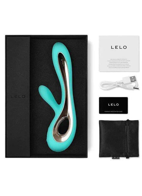 SORAYA 2 Aqua personal massager in turquoise with polished silver accents, displayed with charging cable and storage pouch