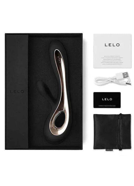 SORAYA 2 Black personal massager with a curved metallic body and black oval detail, shown with USB cable, pouch and packaging