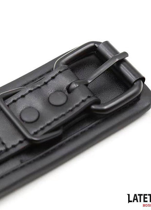 Sponge Lined Handcuffs with black padded PU straps, stitched edges, metal buckle and adjustable snap fasteners