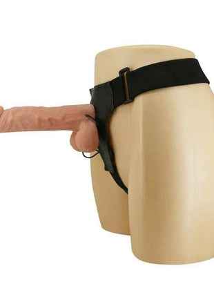 Strap-on with Dildo featuring a flesh-toned, textured silicone dildo and adjustable black straps on a beige mannequin