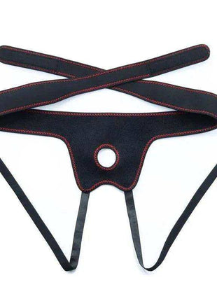 Strap-on with Dildo with Vibration harness in black fabric with red stitching, adjustable straps and a circular opening.