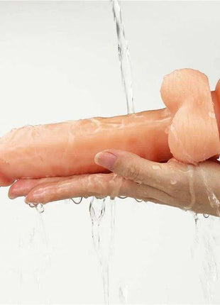 Strap-on with Dildo with Vibration, peach-coloured smooth silicone dildo attached to a harness ring with adjustable straps