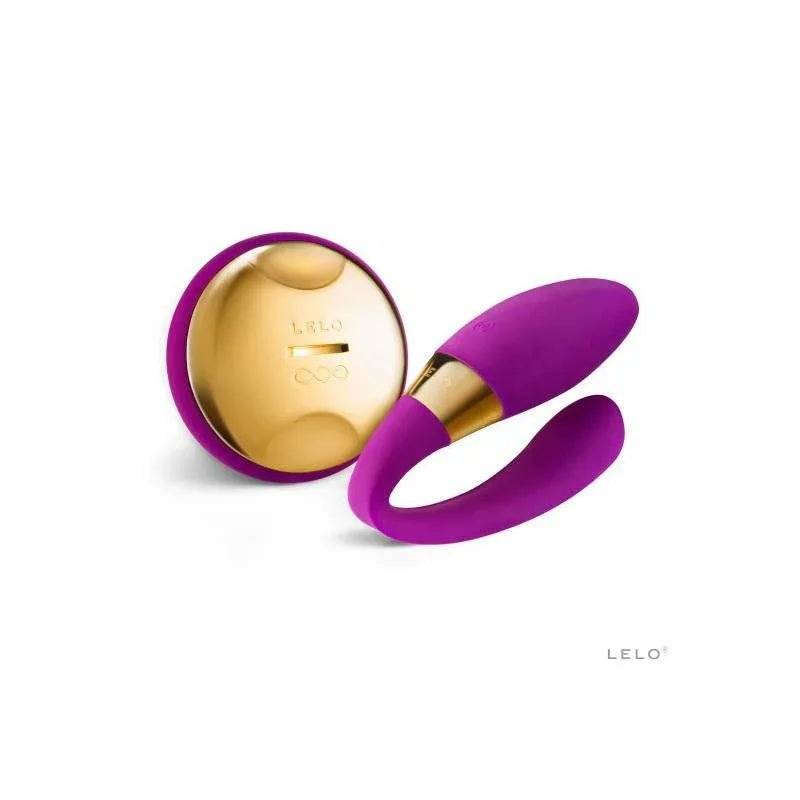 Vibrating personal massager in vivid purple with a gold-tone control face and matching rounded storage case, TIANI 24K Deep Rose