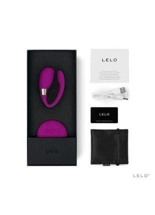 TIANI 3 Deep Rose wearable vibrator in magenta silicone with a curved loop, shown with charging cable and packaging