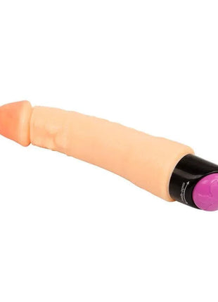 Vibe Flesh 25 cm vibrator with a peach-toned body, gently curved shaft, and black base with a purple control cap