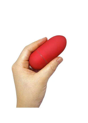 Red vibrating egg with remote control for discreet pleasure
