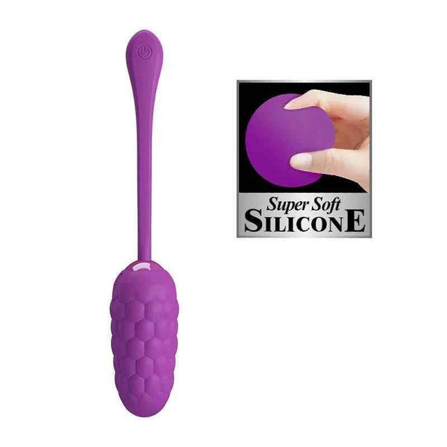 Vibrating Egg USB Silicone Marina in pink with USB charging cable and control button on soft fabric background