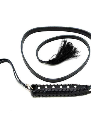 Whip Leather 130 cm in black leather with a braided handle, wrist loop, long coiled strap and tassel tip