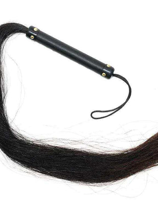Whip with Horse Hair featuring a long black hair tail, black leather handle, brass studs, and wrist loop