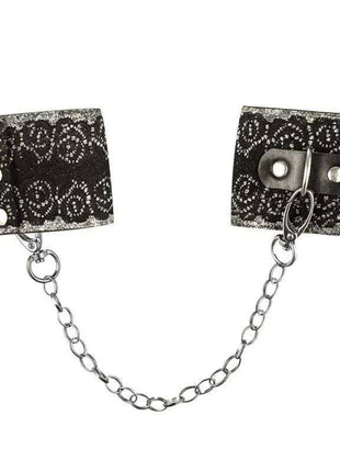 Wrist Cuffs with Lace featuring black fabric with a white ornate pattern, silver snaps, and a connecting chain